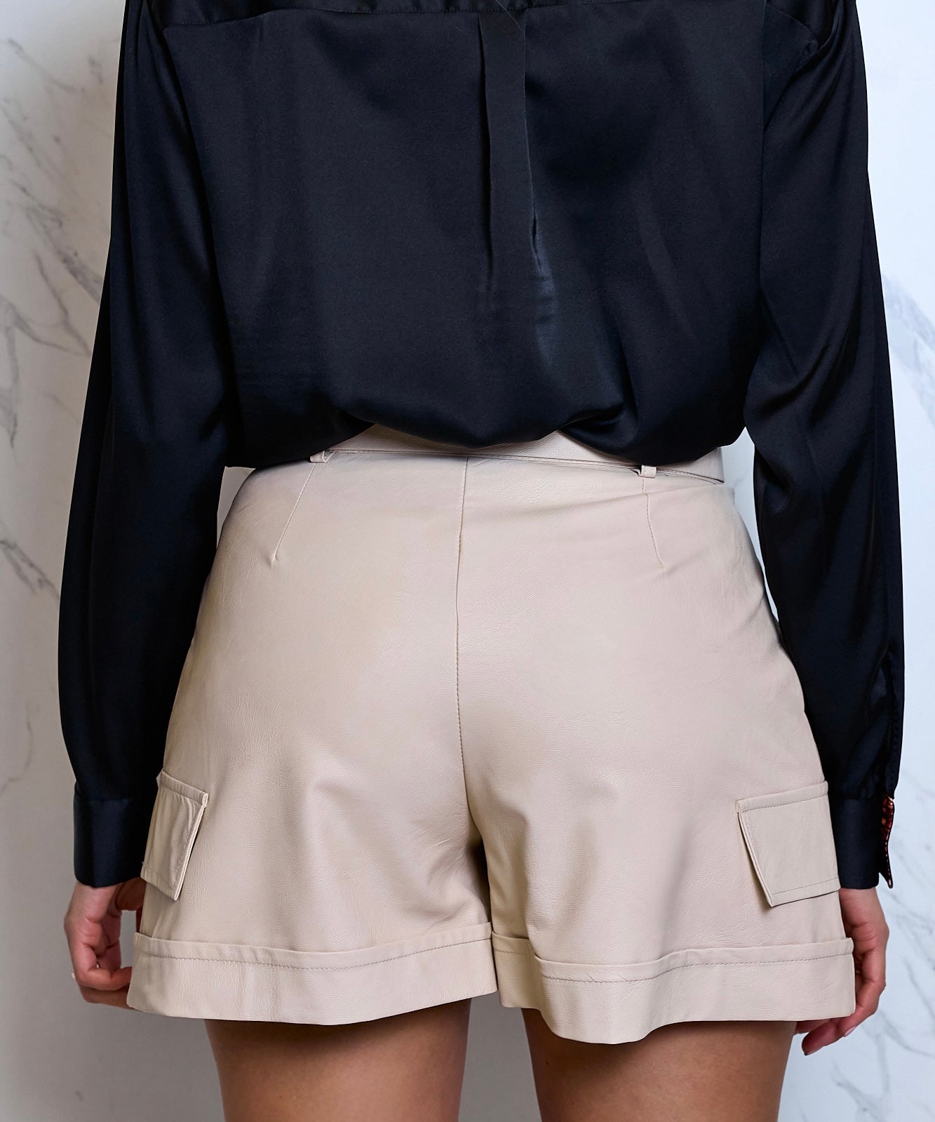Faux leather shorts by Artigli