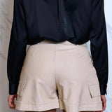 Faux leather shorts by Artigli