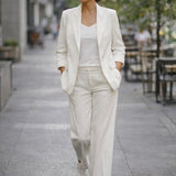 Elegant white women's blazer and pants suit