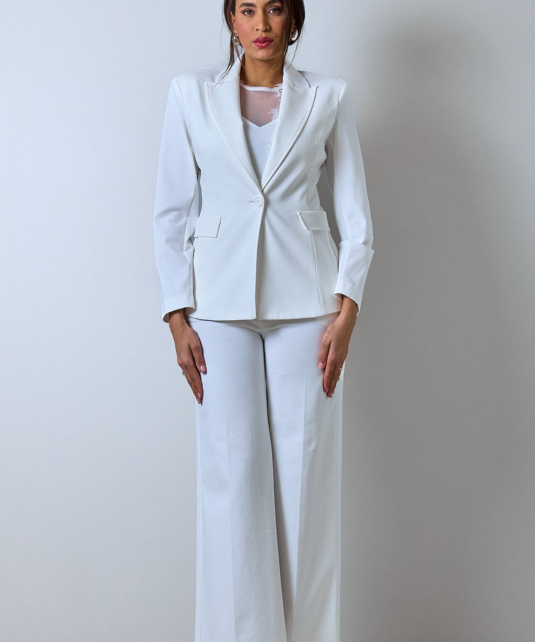 Elegant white women's blazer and pants suit